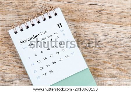 November Calendar 2021 on wooden table background.