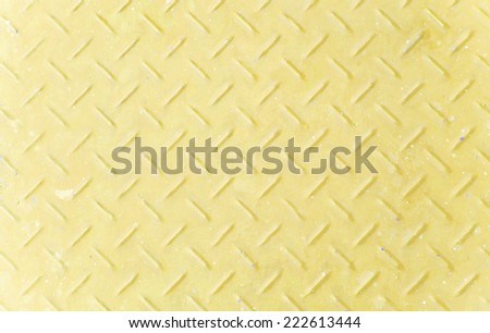 Background of old yellow color metal diamond plate.