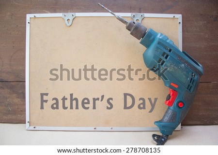 Electric drill and boards fathers day card with text