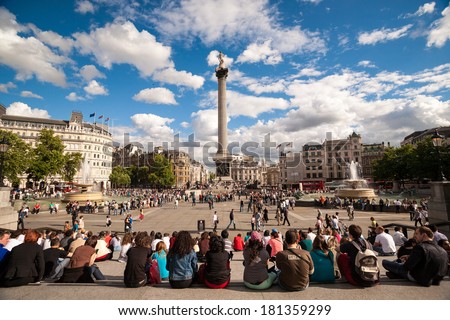 London, UK - July 20 2008 : Tourists are watching Nelson\'s Column in Trafalgar Square, London.