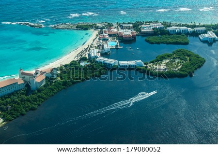 Cancun (Mexico) from birdÃ¢Â?Â?s eye view (Cancun\'s beaches with luxury hotels and  turquoise Caribbean sea and dark lagoon with stunning isles and yachts)