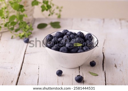 Similar – Image, Stock Photo Fresh organic blueberries in garden