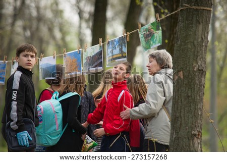 Public event to clean parks of the city of Kiev Ukraine. Children\'s Charity photo exhibition. 04/25/2015 Trukhanov Island