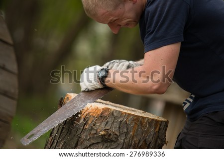 Public event to clean parks of the city of Kiev Ukraine. The man cut down dead trees in the park04/25/2015 Trukhanov Island