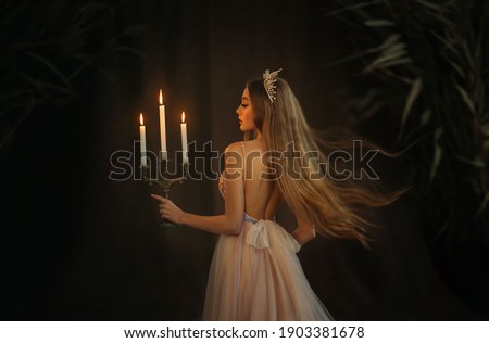 Similar – Image, Stock Photo Woman holding a candle at night, during the Easter celebrations