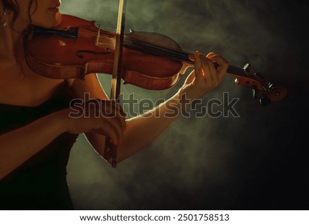 Similar – Foto Bild Nahaufnahme einer Violine mit Bogen. Braune Orchestergeige. Finger auf der Tastatur der Violine.