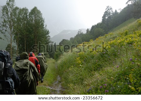 tourist group in rainy highland valley