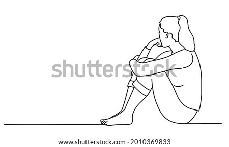 Sad woman sitting on the floor and thinking. Hand drawn vector illustration. Black and white.