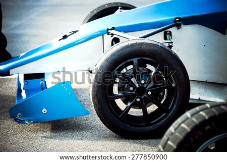front part of racing car focus on wheel