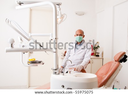 A portrait of an Asian / Indian dentist