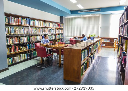 CHIANG MAI, THAILAND - JULY 03 : Two women were researching in the library of the university on July 03, 2014 in Chiangmai, Thailand.
