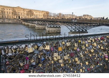 PARIS - January 1:  Locks on Paris bridge near Seine river on January 1, 2015 in Paris, France.