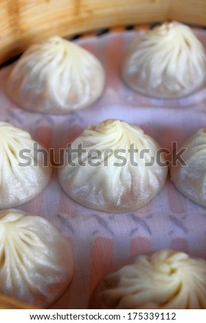 Xiao Long Bao, steamed pork dumplings with soup inside served in bamboo steamer