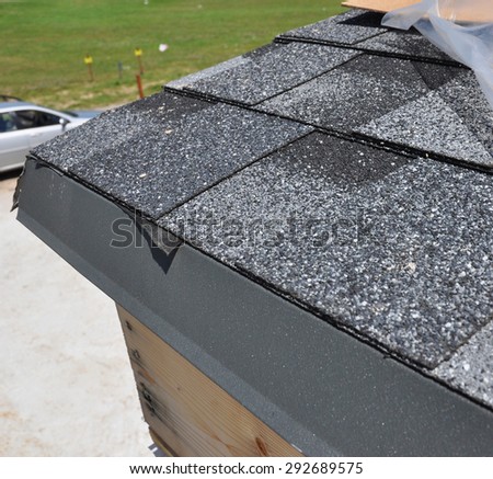 Closeup of waterproof problem roofing. Placement of asphalt shingles