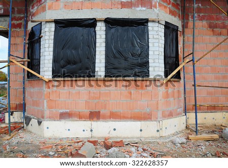 Prepare to Protect Unfinished House Windows for Winter to Avoid Snow and Rain Inside. Reduce Condensation in Unfinished Building