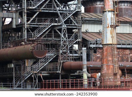 The flanges and old metal constructions in industrial zone