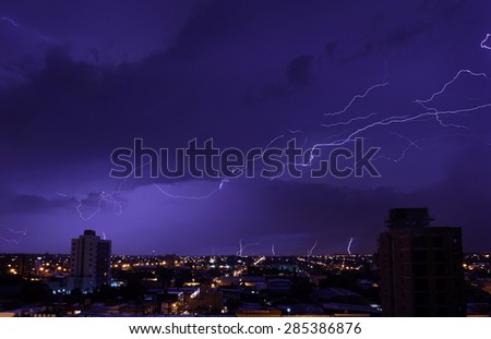 The bright blizzards in the night sky above the city