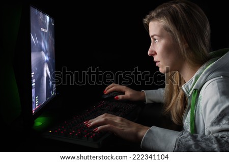 Gamer girl playing a first person shooter