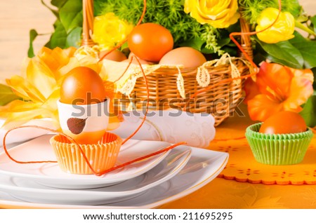 Easter table decoration in orange colours