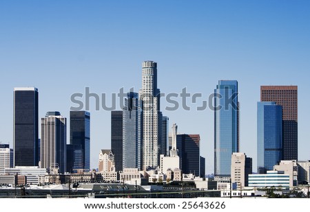 Los Angeles skyline at sunrise on a bright, sunny day.