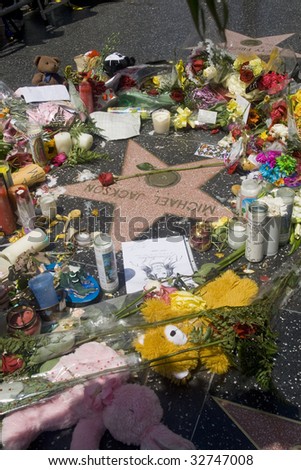 LOS ANGELES - JUNE 26: Michael Jackson\'s star on the Hollywood Walk of Fame in Los Angeles, CA, as fans gather and leave flowers and momentos to remember the artist and say goodbye following his death on June 25, 2009.