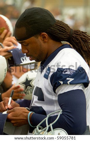 OXNARD, CA-AUGUST 14: Jesse Holley, #16, Wide Receiver of the Dallas Cowboys, signs autographs at opening day practice August 14, 2010 in Oxnard, CA. The team will be in camp here until Aug. 27, 2010.