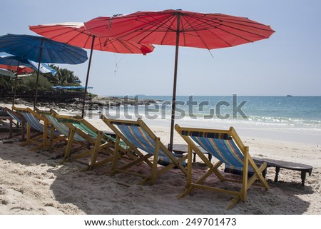 Relax area on beach with red  and blue umbrella to shade