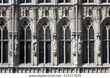 Wall fragment of the Town Hall of the City of Brussels is a Gothic building from the Middle Ages with three sculptures on the parties of windows