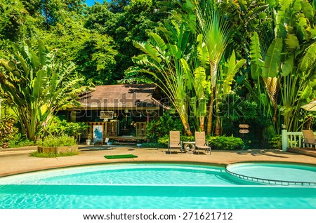 THAILAND, PHI PHI ISLANDS - NOVEMBER 1, 2014: Exotic luxury swimming pool surrounded by palm trees