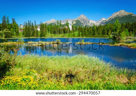Beautiful mountain lake in the background of the high peaks of mountains