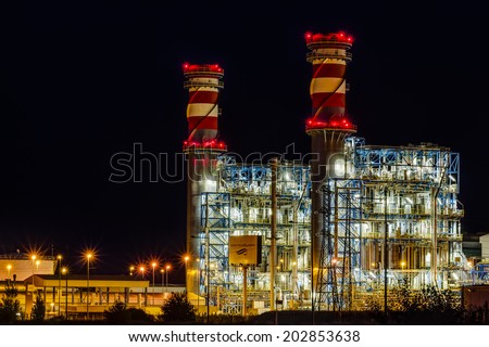 Arrubal, Spain - June 21, 2014: ContourGlobal\'s combined cycle power plant at night in Arrubal, La Rioja, Spain. Built by Siemens, it has two groups of 400MW. ContourGlobal is a New York based company