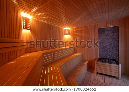 Similar – Image, Stock Photo a wooden sauna from the inside with a man taking a sauna