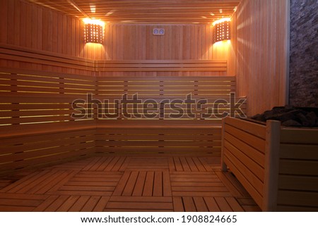 Similar – Image, Stock Photo a wooden sauna from the inside with a man taking a sauna