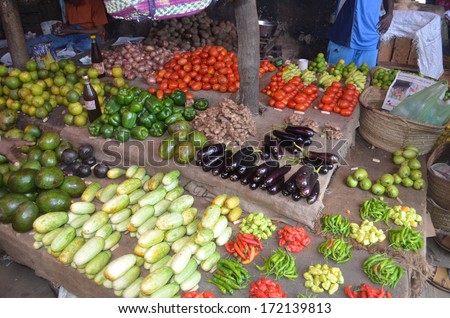 STONE TOWN, ZANZIBAR - DECEMBER 12: Sellers offer fruit and vegetables in the city market on 12 December 2013 in Stone Town, Tanzania.