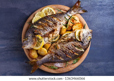 Similar – Image, Stock Photo Grilled fish and potatoes with scallion and sauce