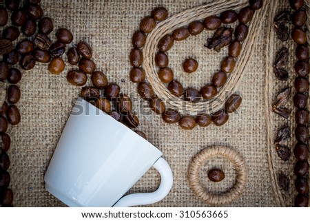 coffee beans , cup, Coffee beans in coffee cup isolated on white