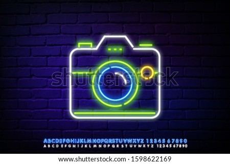 White neon logo for photo studio. Vector isolated neon sign of camera for decoration on the wall background. Concept of photographer profession and creative process.