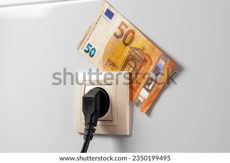 Similar – Image, Stock Photo Socket and euro bills placed in the shape of a circle. Concept of saving electricity at home. Euro banknotes. Electricity costs and expensive energy concept