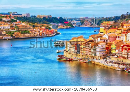 Porto, Portugal old town ribeira aerial promenade view with colorful houses, Douro river and boats Stock foto © 