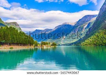 Norwegian landscape with Nordfjord fjord, mountains, forest and glacier in Olden, Norway