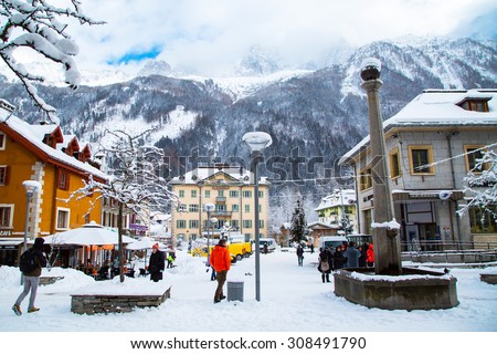 Chamonix, France - January , 30, 2015: Street view, Outdoor Bar, post office, people walking in the center of Chamonix town in French Alps, France