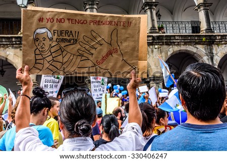 Antigua, Guatemala - August 27, 2015: Locals protest against government corruption & demand resignation of President Otto Perez Molina. Sign reads \
