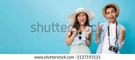 Asian happy young couple tourist preparing for travel with copy space isolated on blue banner background. ストックフォト © 