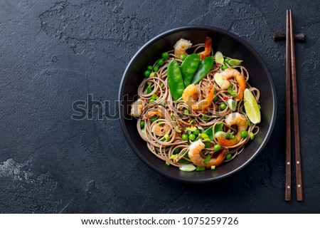 Similar – Image, Stock Photo Spaghetti with seafood. The hands of the head chef prepares a traditional pasta with seafood. The cook pours the sauce over the dish. Restaurant serving dish. Mediterranean Kitchen Banner