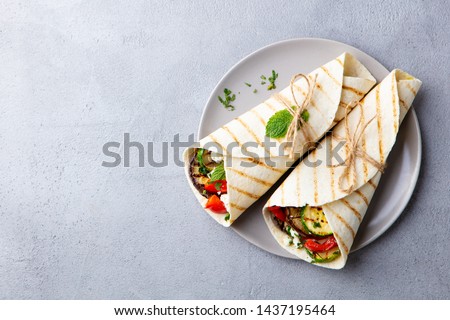 Similar – Foto Bild Pflanzliche Tortilla-Wraps isoliert auf gelbem Hintergrund. Ansicht von oben