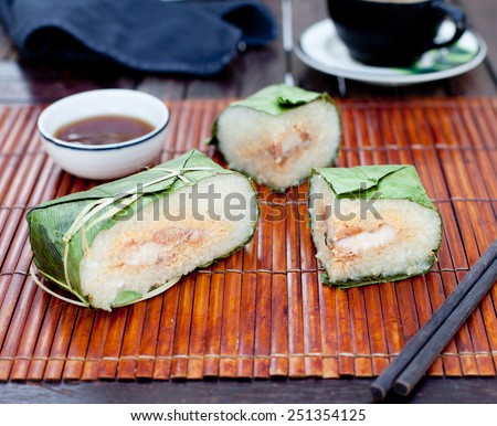 Banh chung, Traditional present for Lunar New Year, Vietnamese traditional dish. Sticky rice cake with meat , covered with banana leaves and, tied with bamboo rope