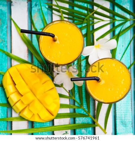 Similar – Foto Bild Mango-Smoothie auf blauer Farbe. Sommerliches Getränk. Mangoshake mit Strohhalm