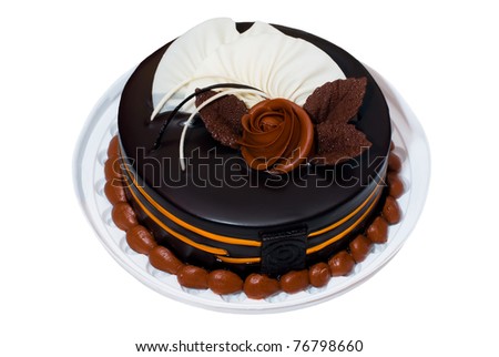 Biscuit chocolate cake with chocolate and rose petals on white isolated background