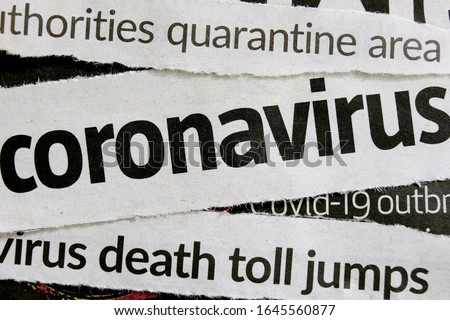 Novel coronavirus breaking news headline clippings from various newspapers reporting on the deadly disease, macro view. Concept for global coverage on severity of Covid-19 or 2019-ncov virus.