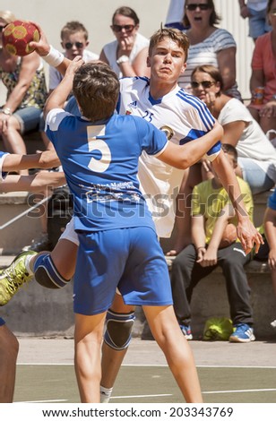 BARCELONA - JUNE 28: Player shooting the ball at GRANOLLERS CUP Handball tournament on June 28 2014 in Granollers, Barcelona, Spain